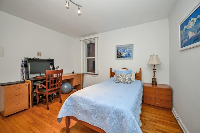 bedroom with light wood-type flooring