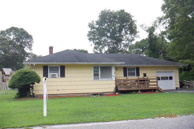 ranch-style home with a deck and a front lawn