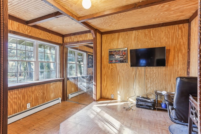 office area with beamed ceiling, light parquet flooring, a baseboard heating unit, and wood walls