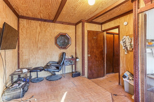 interior space featuring wooden walls, beamed ceiling, light parquet floors, and wooden ceiling