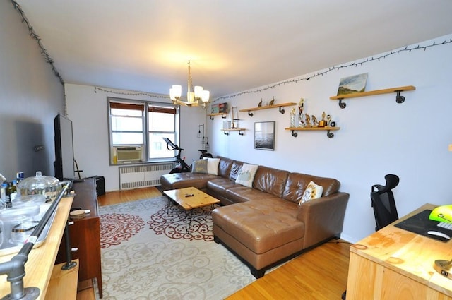 501 Riverdale Ave Unit 6H, Yonkers, NY 10705 - living room with radiator, a chandelier, cooling unit, and wood-type flooring
