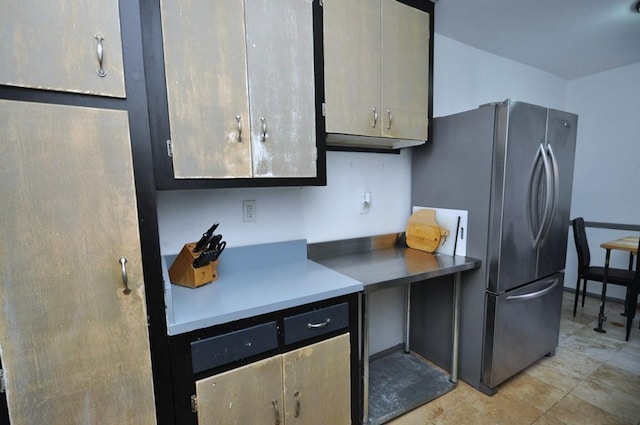 kitchen featuring stainless steel refrigerator