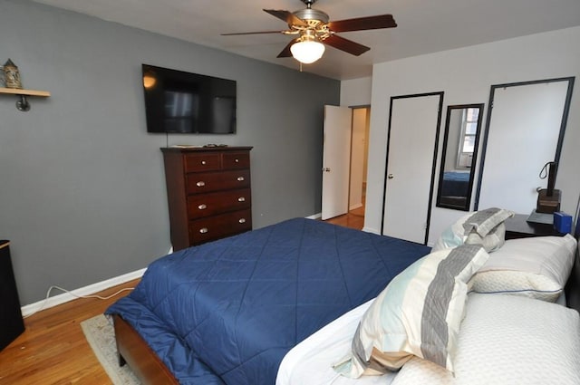 bedroom featuring hardwood / wood-style floors and ceiling fan