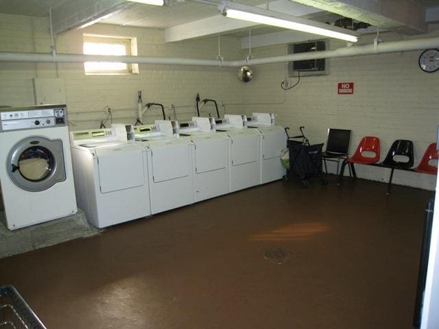 laundry area with independent washer and dryer