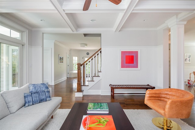 living room with coffered ceiling, plenty of natural light, and dark hardwood / wood-style floors