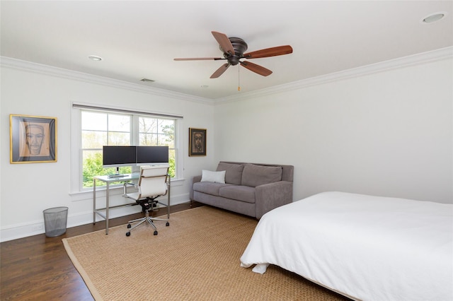 bedroom with ceiling fan, dark hardwood / wood-style floors, and crown molding