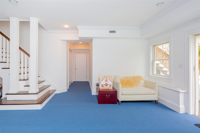 sitting room with carpet floors and crown molding