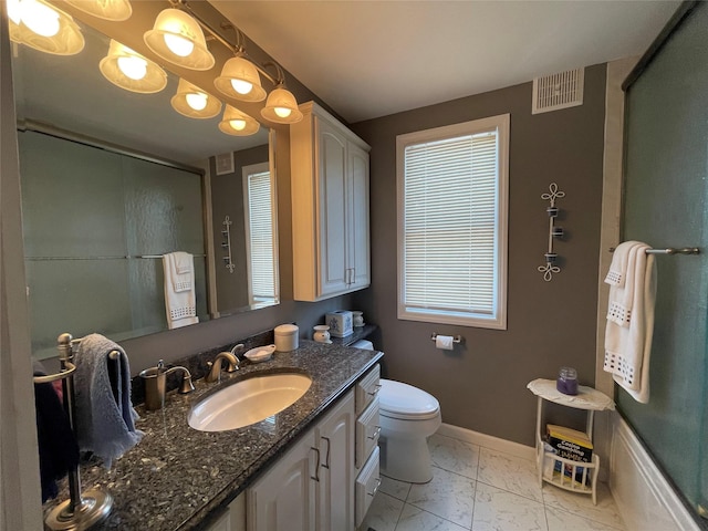 full bathroom with shower / bath combination with glass door, vanity, and toilet