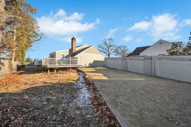 view of yard featuring a wooden deck