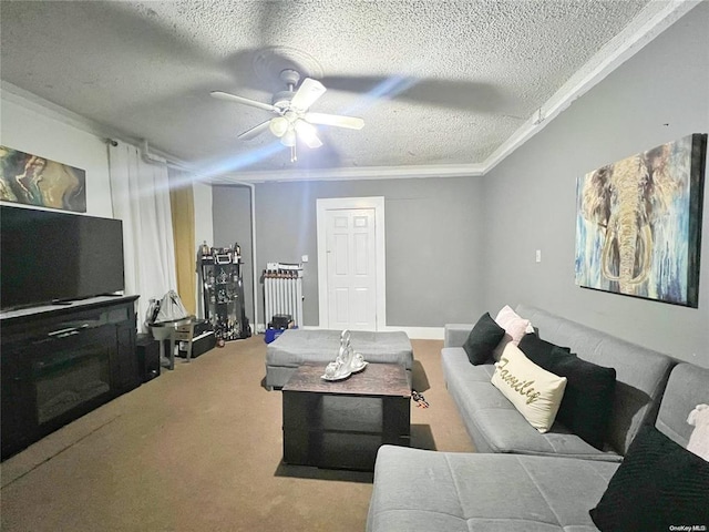 living room with ceiling fan, light colored carpet, ornamental molding, and a textured ceiling