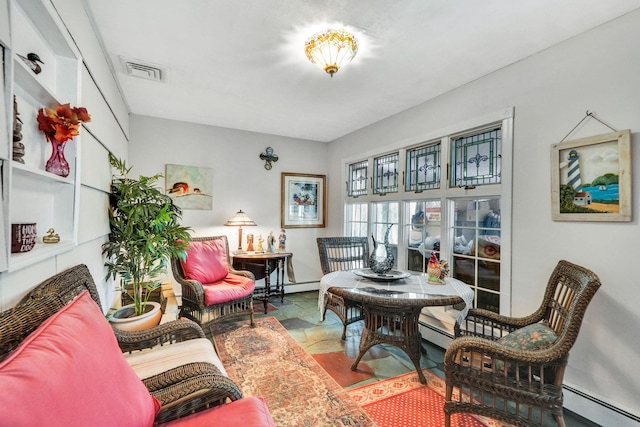 living area featuring a baseboard heating unit