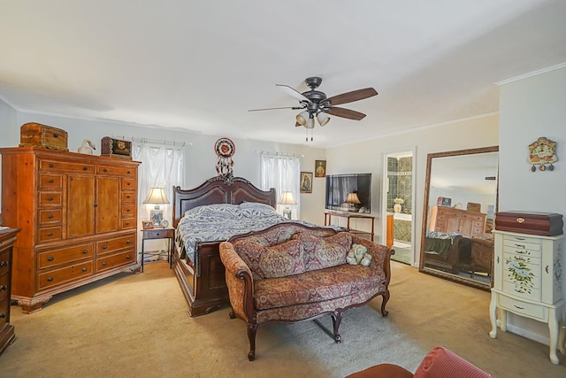 carpeted bedroom featuring ceiling fan and crown molding