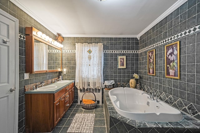 bathroom with vanity, tile walls, ornamental molding, and tiled tub