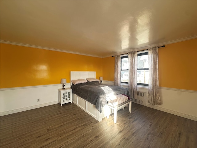 bedroom featuring dark hardwood / wood-style floors and ornamental molding