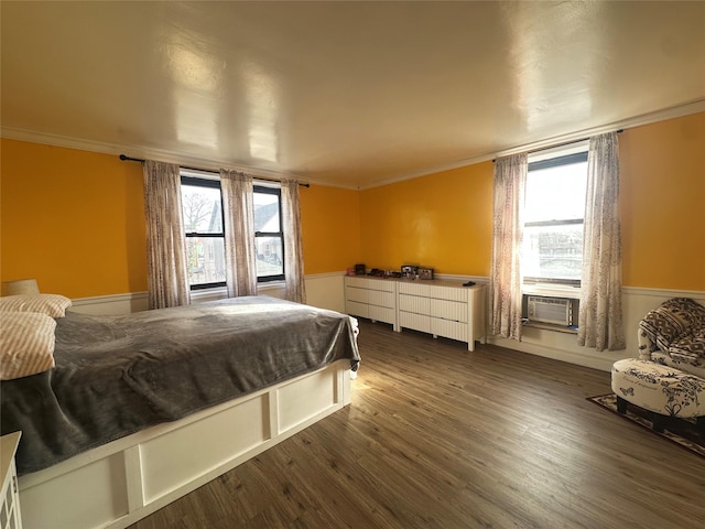 bedroom featuring dark hardwood / wood-style floors and crown molding