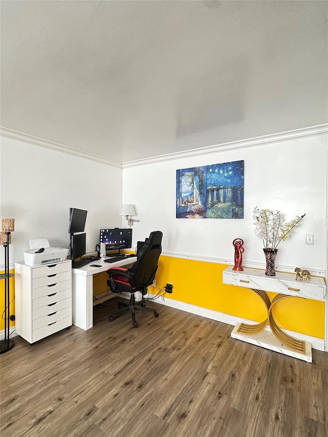 home office with crown molding and hardwood / wood-style flooring