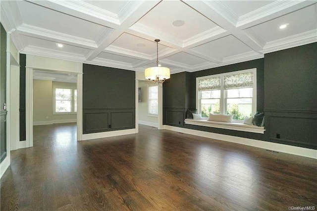 interior space featuring beam ceiling, dark wood-type flooring, coffered ceiling, and a chandelier