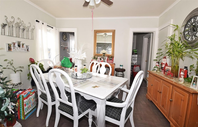 dining room featuring dark parquet flooring, ceiling fan, and crown molding