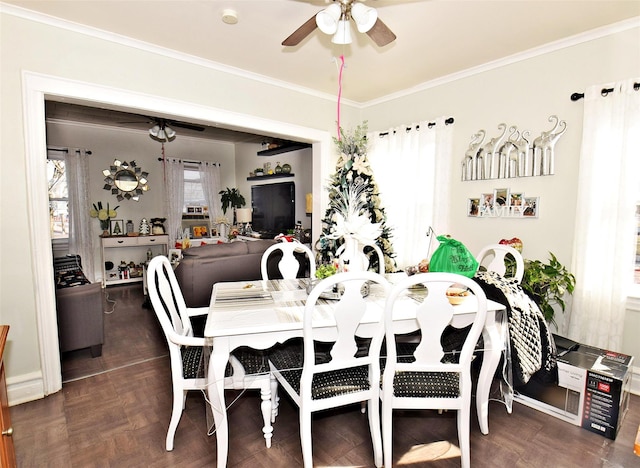 dining room featuring dark parquet floors and ornamental molding