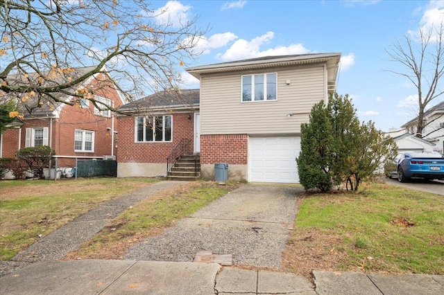 view of front of house featuring a garage and a front lawn