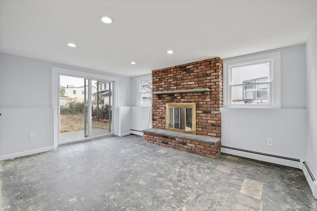 unfurnished living room featuring a baseboard heating unit and a brick fireplace