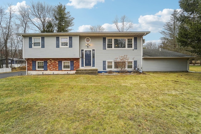 raised ranch featuring a front yard