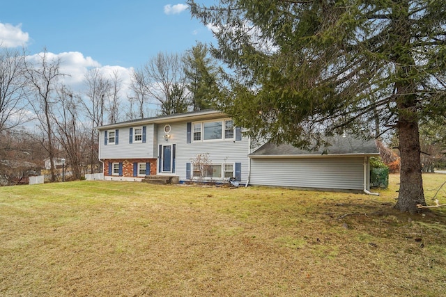 raised ranch with a front lawn