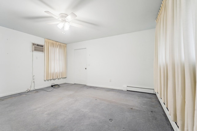 spare room with a wall unit AC, a baseboard heating unit, ceiling fan, and carpet floors