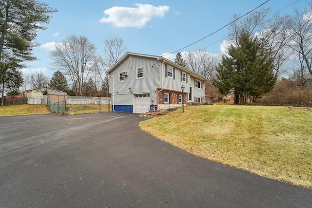 view of property exterior featuring a garage and a yard