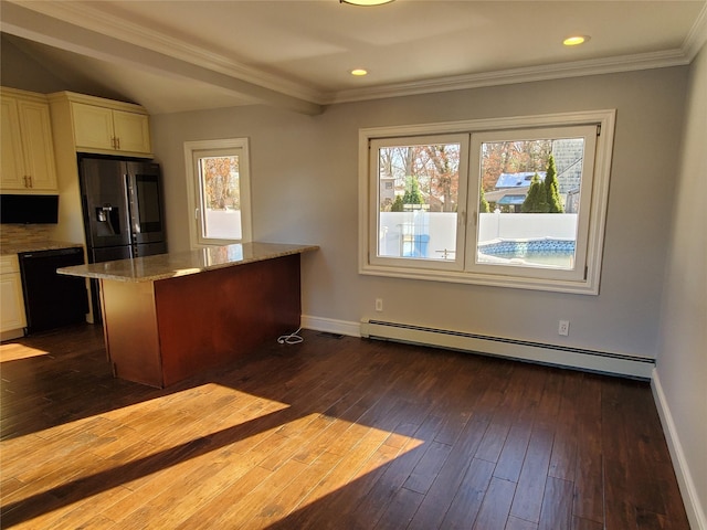 kitchen featuring a baseboard heating unit, a center island, black dishwasher, plenty of natural light, and stainless steel fridge