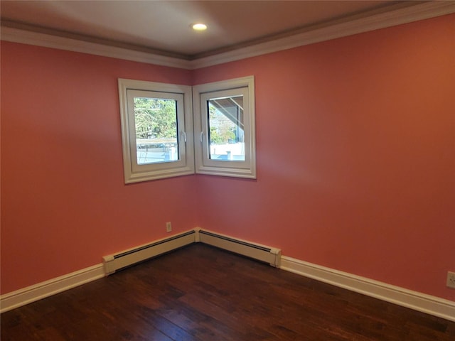 empty room featuring dark hardwood / wood-style flooring and ornamental molding