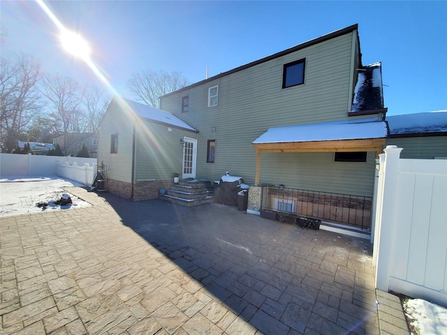 rear view of house with a patio