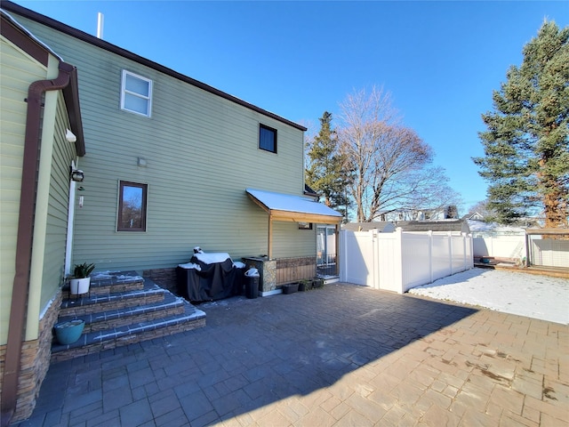 view of property exterior with a patio area