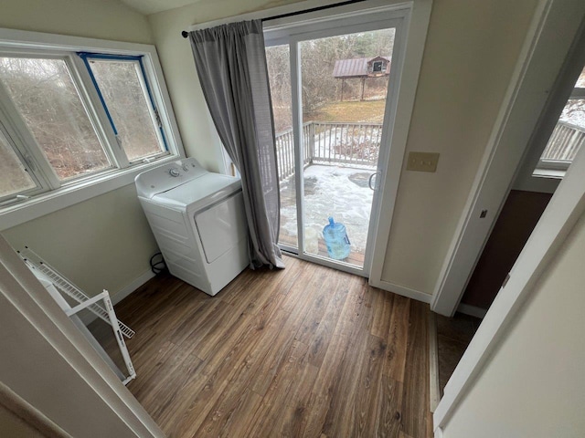 clothes washing area featuring washer / clothes dryer and hardwood / wood-style flooring