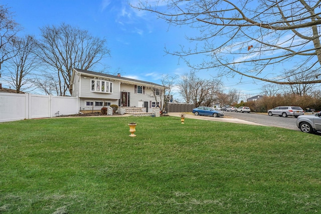 view of front of home with a front lawn