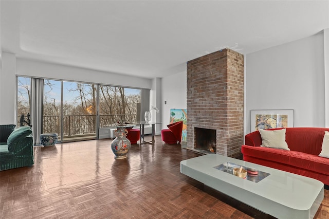 living room with parquet flooring and a fireplace