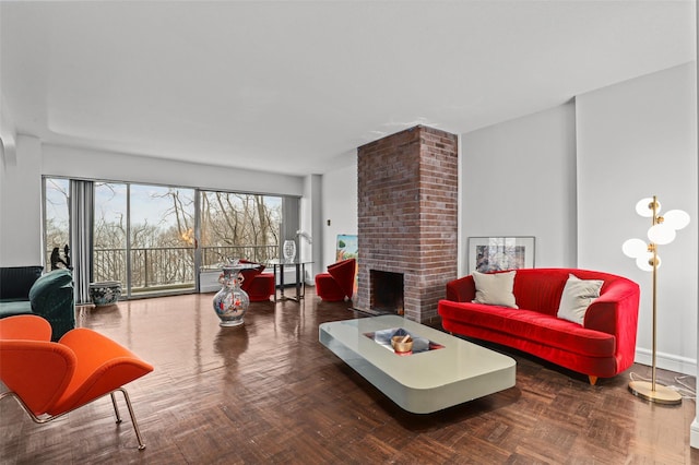 living room with a fireplace and dark parquet floors