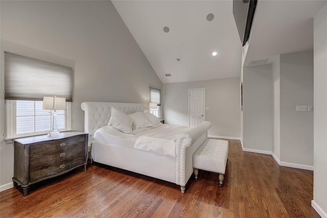 bedroom featuring dark hardwood / wood-style flooring and vaulted ceiling