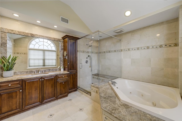 bathroom featuring lofted ceiling, plus walk in shower, tile walls, and vanity