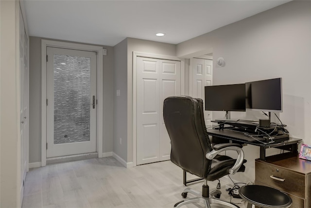 office space with light hardwood / wood-style floors