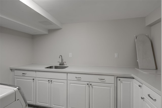 washroom featuring cabinets and sink