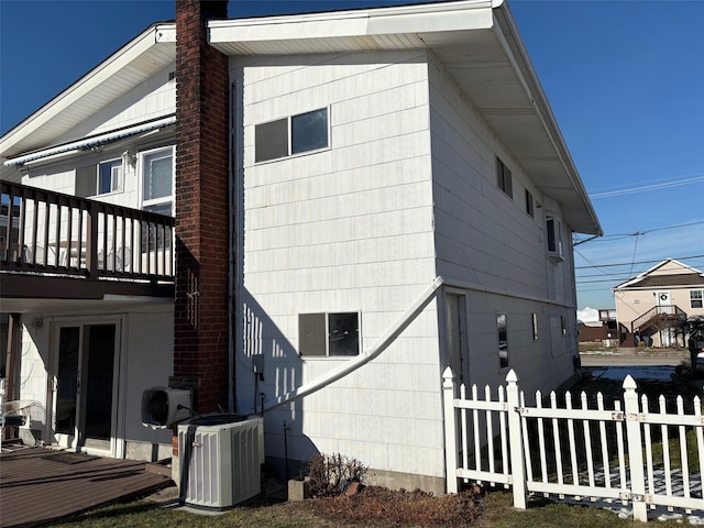 view of property exterior featuring ac unit and central air condition unit