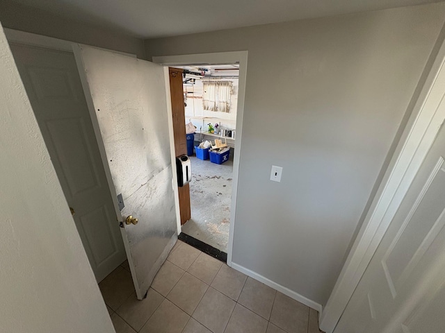 hallway featuring light tile patterned flooring