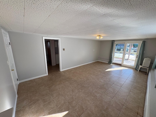 unfurnished room featuring light tile patterned floors