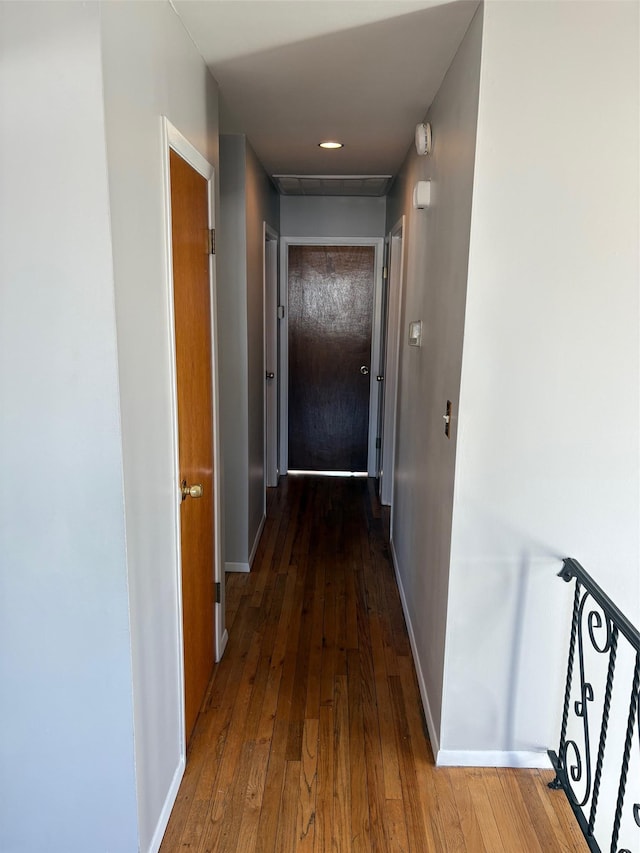 hall with dark wood-type flooring