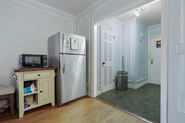 kitchen featuring stainless steel refrigerator and light wood-type flooring