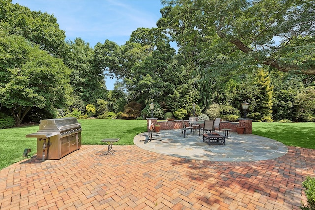 view of patio featuring area for grilling and an outdoor fire pit