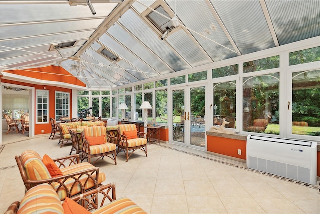 sunroom / solarium with a wall mounted AC and vaulted ceiling