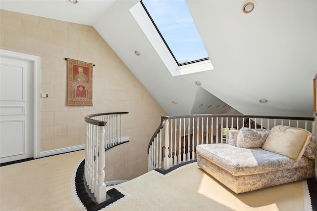 sitting room featuring vaulted ceiling