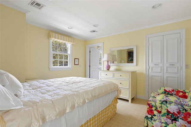 bedroom with crown molding and a closet